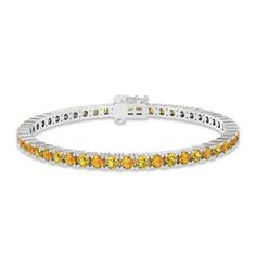 Gleaming round golden and Madeira citrines radiate sunny hues on this cheerful bracelet for her. Styled in classic sterling silver, the 7.25-inch bracelet secures with a tongue clasp. Classic Yellow Jewelry With Jubilee Bracelet, Yellow Jubilee Bracelet, Classic Yellow Bracelet, Yellow Jubilee Bracelet For Anniversary, Anniversary Yellow Jubilee Bracelet, Fine Jewelry Yellow Bracelets For Anniversary, Yellow Fine Jewelry Bracelets For Anniversary, Fine Jewelry Yellow Bracelets As A Gift, Yellow Citrine Gemstone Bracelets