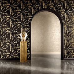 an arch in the middle of a room with wallpaper and a vase on it