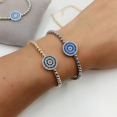 Evil Eye Bracelet is adjustable so it comfortably fits on any wrist. Turkish bracelet is beaded with gold and silver beads. Evil Eye on the bracelet is made of zircon. This nazar, cz bracelet is great for daily wear. It is tarnish resistant. Dainty evil eye bracelet would be a perfect birtday gift or Christmas gift. For more evil eye bracelets, click the link below; https://www.etsy.com/shop/EyeDesignsbyGG?ref=search_shop_redirect&section_id=30219689 Adjustable Cubic Zirconia Beaded Bangle Bracelets, Adjustable Cubic Zirconia Bracelet, Adjustable Jubilee Crystal Bracelet, Adjustable Round Jubilee Crystal Bracelet, Adjustable Round Cubic Zirconia Crystal Bracelet, Adjustable Cubic Zirconia Evil Eye Bracelet Gift, Adjustable Cubic Zirconia Chain Bracelet, Turkish Bracelet, Greek Eye