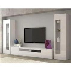 a flat screen tv sitting on top of a white entertainment center in a living room