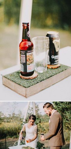 a couple cutting their wedding cake on top of a wooden box with beer in it