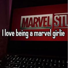 the words i love being a marvel girlie are displayed on a laptop computer screen