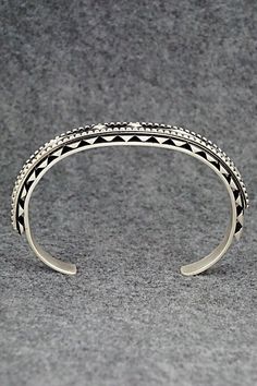 This sterling silver bracelet was made by Navajo silversmith Leander Tahe. The inside is signed L. Tahe and stamped sterling.Size: 5 3/4" (will fit up to a 7 1/8" wrist)Gap: 1 3/8"Width: 3/8"Free shipping on all orders! We ship with USPS and always include tracking. All orders ship within a day of payment.Returns are accepted up to 30 days after you receive your order. Just send us a message. Our shop offers cash back or store credit. The item must be returned in new condition. Chunky Silver Jewellery, Sterling Silver Bracelet, Native American Jewelry, Free Jewelry, Sterling Silver Bracelets, Cuff Bracelets, Silver Bracelet, Silver Jewelry, Gap