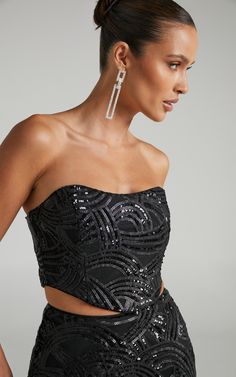 Make our Kenny Corset Top the newest addition to your party wardrobe! This strapless number will have all eyes on you. It features a subtle sweetheart neckline, dipped hem and tonal sequin detailing all over. Perfect for parties or nights out, you can easily dress it up or down depending on the vibe.Dress it up by teaming it with the Kenny Sequin Mini Skirt in Black and the Novo - Zeros Heels in Black or down with relaxed trousers and chunky sneakers!Product Details  Invisible zipper on the cent Sequin Corset Top, Sequin Corset, Basic Black Dress, Sequin Mini Skirt, Neon Outfits, Bachelorette Dress, Spring Maxi Dress, Relaxed Trousers, Navy Bridesmaid Dresses