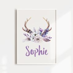 the name sophiie is surrounded by antlers and flowers on a white background