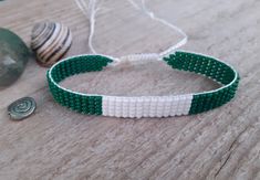 Hand woven loom beaded bracelet with Nigeria flag. Patriotic  beads wristband with country state symbols is a great gift for a women, girl or child for birthday, Christmas, Valentine's Day and other holidays. Small frienship memorable gift for best friend. The bracelet suitable for daily wear. Bracelet in stock and ready to ship. Other braselets with flags here: https://www.etsy.com/shop/BeadSeeShop?ref=seller-platform-mcnav&section_id=36120104 More bracelets here: https://www.etsy.com/shop/Bead Handmade White Beaded Bracelets As Souvenir, Daily Wear Bracelet, Nigerian Flag, Nigeria Flag, Flag Beads, Handwoven Earrings, State Symbols, Word Bracelet, Beaded Cuff Bracelet