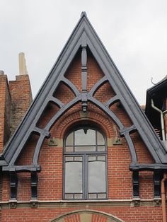 an old red brick building with arched windows