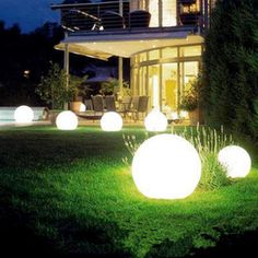 some lights that are sitting in the grass