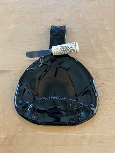 a bottle with a knife sticking out of it