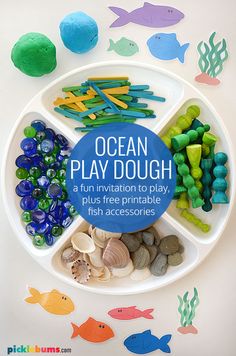 an ocean play dough is displayed on a plate with fish and sea creatures around it