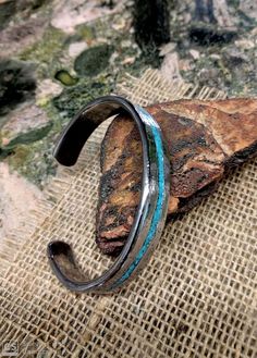 * Turquoise Stainless Cuff Bracelet.*  Heavier Version .  3.75 X 13.5 mm Thick and Wide.*  Turquoise Inlay.*  Textured Sand Dust on  face.*  Measure your whole wrist size with tight and mark it on the option.  Do not add or less on actual measure.  It can not be resizing and so not returnable.  * Wrist size 6" - 6.5" has 1 " gap                     6.75- 7.5" has 1.2" gap                     7.75- 8.5" has 1.5" gap.                      ***If you want special size gap, please leave it on the not Bangle For Men, Turquoise Bracelets, Inlay Jewelry, Copper Cuff Bracelet, Men Bracelet, Copper Cuff, Moon Jewelry, Bangles Jewelry, Jewelry Tutorials