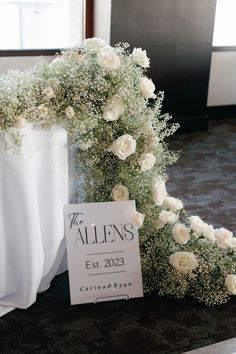 white flowers and baby's breath are on display at the altars for wedding guests