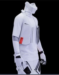 a mannequin dressed in white and black with a red tag on it's chest