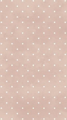 a pink background with white polka dots