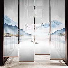 an artistic scene with mountains and birds in the sky is shown through large glass doors