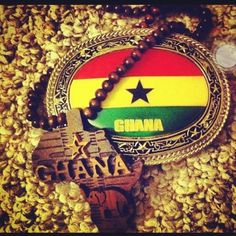 a wooden beaded necklace with the word ghana on it and a flag in the center