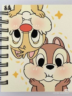 a spiral notebook with an image of two cartoon animals