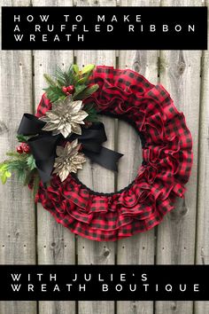 a red and black wreath sitting on top of a wooden fence with the words how to make