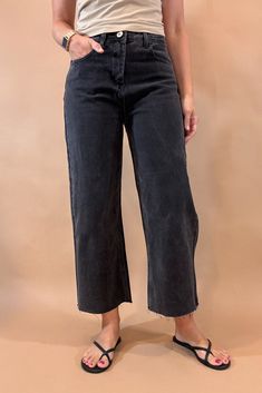 Get ready to rock the edgy chic look with these Black Crop Wide Leg Jeans. With a 23 1/2 inch seam, raw hem, slight (very slight) stretch, and distressed details, they exude effortless coolness. The lightweight denim is tapered in the back for the perfect fit, while maintaining the relaxed wide leg style. Dare to be different! Fit is true to size, Amber is modeling size small. She is 5’6”. Imported Cotton blend. Crop Wide Leg Jeans, Nickel And Suede, Cropped Wide Leg Jeans, Edgy Chic, Dare To Be Different, How To Make Handbags, Black Crop, Ethical Fashion, Wide Leg Jeans