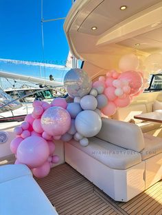 balloons are attached to the back of a boat