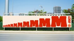 a large billboard with the word mmm on it