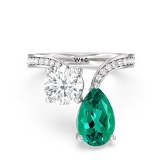 An absolute stunner, this two-stone ring with a beautifully curved band makes an excellent choice to pledge your love and commitment. Its polished shank features diamond-traced shoulders with ends that don't meet. One end slightly curves and holds a 1.75 ct round diamond while the other end curves more dramatically, securing a 2.50 ct pear-cut Created Emerald. Teardrop Brilliant Cut Emerald Wedding Ring, Elegant Teardrop Moissanite Rings, Wedding Teardrop Emerald Ring With Brilliant Cut, Elegant Teardrop May Birthstone Ring, Elegant Teardrop Emerald Ring For Anniversary, Elegant Emerald Ring With Vs Clarity, Elegant Round Emerald Ring With Vs Clarity, Elegant Pear-shaped Cubic Zirconia Emerald Ring, Emerald Teardrop Ring With Brilliant Cut