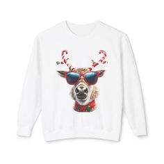 The Festive Reindeer Unisex Lightweight Crewneck Sweatshirt is the perfect addition to any holiday celebration wardrobe. Designed for both comfort and style, this cozy sweatshirt is ideal for family gatherings or as a thoughtful gift for Secret Santa exchanges. Its whimsical reindeer design brings a touch of humor and joy to seasonal festivities, making it a standout piece for holiday fun. Made from high-quality, lightweight materials, it ensures warmth without compromising breathability, making White Sweatshirt For Fall Holiday, Holiday White Crew Neck Top, White Crew Neck Top For Holidays, Holiday White Graphic Print Sweatshirt, Holiday Graphic Print White Sweatshirt, Holiday White Crew Neck Sweatshirt, White Holiday Crew Neck Sweatshirt, White Crew Neck Sweatshirt For The Holidays, White Crew Neck Holiday Sweatshirt