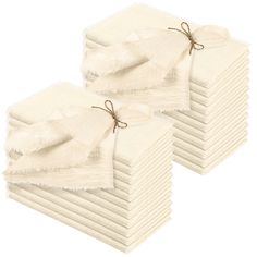 a stack of white napkins tied with twine