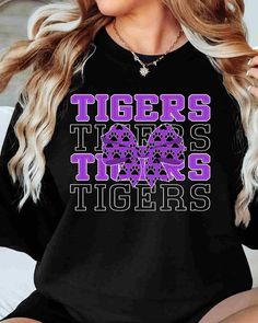 Looking for a fun and unique way to show off your Tigers spirit? Look no further than our Tigers DTF Transfer! This transfer is perfect for creating your own custom t-shirts, hoodies, and more. With our high-quality DTF transfer process, you can expect vibrant, full-color designs that will stand the test of time. This transfer features the Tigers DTF transfer in a bold and eye-catching coquette bow design. Our transfers are incredibly easy to apply using a standard heat press. Whether you're a s Trendy Black Tops For Game Day, Black Fan Apparel T-shirt With Lettering, Black Graphic Print Sublimation Design For College, Black T-shirt With Lettering For Fan Merchandise, Pre-shrunk Black Sweatshirt For Fan Merchandise, Black Pre-shrunk Sweatshirt For Fan Merchandise, Black Slogan Tops For Fan Merchandise, Black Cotton Sublimation Design For Game Day, Black Sweatshirt For School Spirit Streetwear