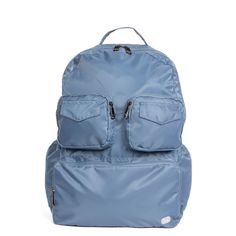 a blue backpack with two pockets on the front and one pocket open to show it's contents