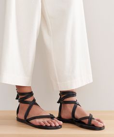 Nina Sandal BlackDesigned to elevate any outfit in an instant, the Nina Sandal is our take on a laced-up classic.Luxe sandal with soft leather laces with leather footed.Made in Portugal Leather Lace-up Sandals With Ankle Strap, Leather Ankle Tie Lace-up Sandals For Vacation, Ankle Tie Lace-up Sandals With Cross-tied Design, Ankle Tie Leather Sandals For Vacation, Vacation Leather Ankle Tie Sandals, Leather Ankle Strap Lace-up Sandals For Vacation, Leather Ankle Tie Sandals For Vacation, Leather Lace-up Ankle Tie Sandals, Adjustable Ankle Tie Leather Sandals