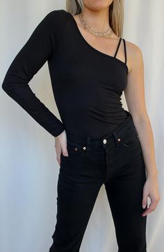 COLOR: BLACK DETAILS Features a one shoulder design, fixed straps and snap button bottom closure stretch 96% Polyester, 4% Spandex Please refer to the care label for garment care instructions SIZE & FIT: runs TTS, model wears size S MODEL INFO: HEIGHT 5’6, WAIST 25in, BUST 32in Black Off-shoulder Stretch Bodysuit, Asymmetrical Black Stretch Bodysuit, Black Stretch Off-shoulder Bodysuit, Off-shoulder Stretch Bodysuit, Stretch Off-shoulder Elastane Bodysuit, Stretch Elastane Off-shoulder Bodysuit, Black Off-shoulder One Shoulder Top, Fitted One-shoulder Bodysuit, Black One-shoulder Elastane Tops