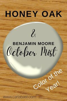 a button with the words, honey oak and benjam moore october mist color of the year