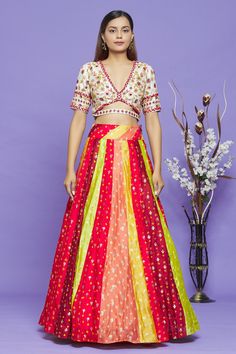 Multicolor bandhani lehenga with contrast woven floral motifs. Comes with white blouse with all-over sequin, French knot and thread embroidery.
Component: 2
Pattern: Embroidery
Type Of Work: Thread, Sequin and Woven Floral Motifs
Neckline: V neck
Sleeve Type: Half
Fabric: Pure Bandhani
Color: Multi Color
Other Details: 
Cutout detail at the waist and back
Kalidar lehenga
Lehenga with tie up on the side
Closure: Blouse: Metallic buckle
Occasion: Sangeet - Aza Fashions Navratri Multicolor Pre-draped Saree With Resham Embroidery, Festive Multicolor Pre-draped Saree With Resham Embroidery, Fitted Multicolor Pre-draped Saree For Eid, Multicolor Bandhani Print Pre-draped Saree For Wedding, Multicolor Designer Pre-draped Saree For Navratri, Designer Multicolor Pre-draped Saree For Navratri, Designer Art Silk Sets With Bandhani Print, Multicolor Bandhani Print Chanderi Choli, Multicolor Pre-draped Bandhani Saree For Transitional Season