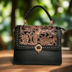 Featuring a gorgeous chiseled artisan design, this rustic  Hand Tooled Leather Bag will help you bring a little vintage flair to your everyday outfit. The perfect size for fitting all of your everyday essentials, this purse was actually handmade with love and care  with help of talented  artisans . height: 23cm. 9 inches width : 28cm.  11inches  base: 12cm.    4.5  inches  Adjustable and detachable large strap:125 cm  49 inches Fabric lining Zipper at the top interior: 1 zippered compartment. ex Vintage Engraved Satchel Bag, Vintage Engraved Bags For Everyday Use, Vintage Top Handle Shoulder Bag With Hand Tooled Detail, Vintage Engraved Shoulder Bag For Daily Use, Vintage Top Handle Shoulder Bag With Hand Tooling, Engraved Satchel Bag For Daily Use, Vintage Hand Tooled Top Handle Shoulder Bag, Engraved Satchel For Daily Use, Vintage Hand Tooled Top Handle Bag