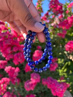 Lapis Lazuli: Deep blue 8mm round beaded bracelet with gold-like speckles available on Etsy. Lapis Lazuli Natural Stone Bracelet As A Gift, Lapis Lazuli Gemstone Beads Bracelet For Gift, Lapis Lazuli Beaded Bracelet Gift, Spiritual Lapis Lazuli Beaded Gift Bracelets, Hand-strung Lapis Lazuli Bracelets For Meditation, Lapis Lazuli Crystal, Lapis Lazuli Bracelet, Lapis Lazuli Jewelry, Lapis Lazuli Beads