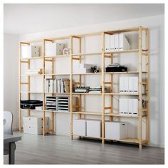 a room with some shelves filled with files