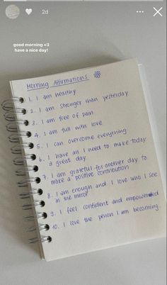 an open notebook with writing on it