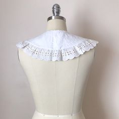 A handmade collar created from embroidered vintage textiles and trim. It has a beautiful cutwork design on cotton fabric. It fastens with a hook and eye. One size. Classic White Fitted Collars, White Detachable Fitted Collar, White Fitted Detachable Collar, White Fitted Peter Pan Collar, White Lace Peter Pan Collar, White Lace Collar For Spring, The Good Witch, Hook And Eye, A Hook