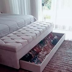 a bed that has some shoes in it