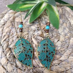 These Women's Earrings Are An Excellent Addition To Any Jewelry Collection. The Bronze Metal Gives Them A Unique And Stylish Look, With Beaded Detailing That Adds A Boho Vibe. The Earrings Feature A Leaf Shape In A Beautiful Blue Color, Making Them Great For Any Occasion. Perfect For Those Who Love Handcrafted And Artisan Jewelry, These Earrings Are A Must-Have For Fashion-Forward Women. They Are Perfect For Adding A Pop Of Color To Any Outfit, And The Dangle/Drop Style Makes Them A Great Choice Turquoise Metal Beaded Bohemian Earrings, Turquoise Bohemian Beaded Earrings For Pierced Ears, Vintage Turquoise Earrings For Summer, Bohemian Leaf-shaped Metal Earrings, Bohemian Leaf-shaped Metal Jewelry, Handmade Turquoise Casual Earrings, Bohemian Turquoise Beaded Earrings For Gifts, Bohemian Turquoise Beaded Earrings As Gift, Bohemian Blue Beaded Hypoallergenic Earrings