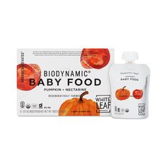 the baby food pouch is next to it's packaging and its contents are white