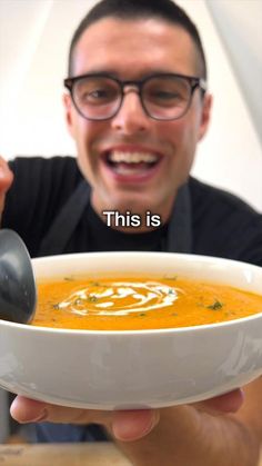 a man holding a bowl of soup with the caption, this is