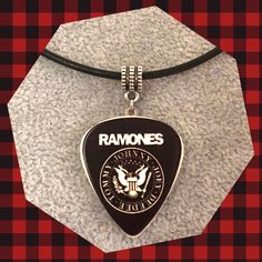 Sheena is a Punk Rocker! ☠️ For men and women  Ramones delrin pick on off white stone pick with stainless steel fixtures and hanging silver bail.  Length approx 1 3/4 inches Style choice:  Stainless steel chain 20" Black leather cord 18" (w/2" ext) Silver Rocker Style Jewelry For Concerts, Adjustable Rocker Style Jewelry For Concerts, Goth Music, A Punk, Music Jewelry, Badass Style, Punk Rocker, Rocker Style, Rock Punk