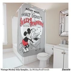 a bathroom with a mickey mouse shower curtain