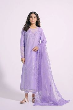 An aesthetically appealing composition is portrayed on this graceful outfit rendered in an appealing lilac shade. It features a classy silhouette shirt beautifully adorned with intricate embroidery at front and sleeves illustrating captivating floral designs with schiffli technique. Paired with a gracefully draped embroidered dupatta with scalloped borders, this gorgeous outfit is a style statement for formal gatherings this season. -Lilac Color -Fabric: Lawn Shirt & Nylon Stripe Dupatta -2 piece Elegant Spring Organza Lawn Suit, Unstitched Elegant Kurta With Cutwork, Elegant Unstitched Kurta With Cutwork, Elegant Unstitched Cutwork Kurta, Unstitched Elegant Salwar Kameez With Cutwork, Elegant Unstitched Salwar Kameez With Cutwork, Elegant Organza Salwar Kameez With Floral Embroidery, Elegant Long Sleeve Salwar Kameez With Cutwork, Festive Purple Kurta With Floral Embroidery