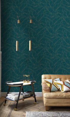 a living room with green wallpaper and gold accents