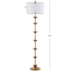 the golden metal floor lamp is shown with a white square shade on it's side