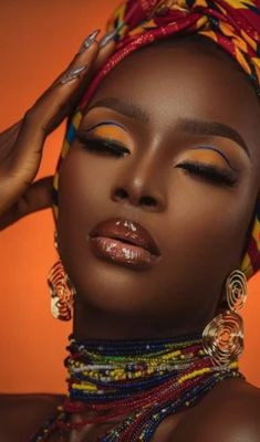 an african woman with bright jewelry on her head