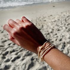 The perfect layering bracelet for your stacks! A delicate genuine freshwater seed pearl stretch bracelet with 3mm pearls and an 18K vermeil gold palm charm with cubic zirconia stones. The relaxed measurement is 6 1/4". Looks great stacked with those gold filled ball bracelets that are so popular or with our other stacking pearl bracelets. All orders over $50 ship for free within the USA. All orders usually ship within 24 hours from the USA. Everyday Stackable Pearl Bracelet, Dainty Stackable Pearl Bracelet, Dainty Pearl Stackable Beaded Bracelets, Dainty Stackable Pearl Beaded Bracelets, 2mm Beads, Pearl Bracelets, Love T, Sea Witch, Ball Bracelet